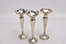 THREE SILVER POSY VASES, each with a wavy rim, two with tapered square stems, one with a tapered