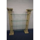 A CONTINENTAL STYLE FOUR TIER SHELVING UNIT, made up of two cream resin Corinthian columns joined by