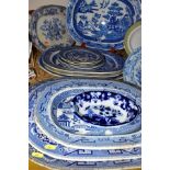 FIFTEEN PIECES OF BLUE AND WHITE CERAMICS, mostly late Victorian, comprising eight meat plates,