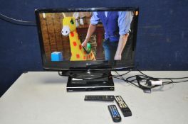 A LG 27in TV with remote, a Toshiba DVD player with remote and a Goodmans Freesat player with remote