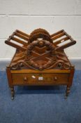 A GEORGE IV ROSEWOOD TRIPLE DIVISION CANTERBURY, the X frame with a carved wreath to the front and