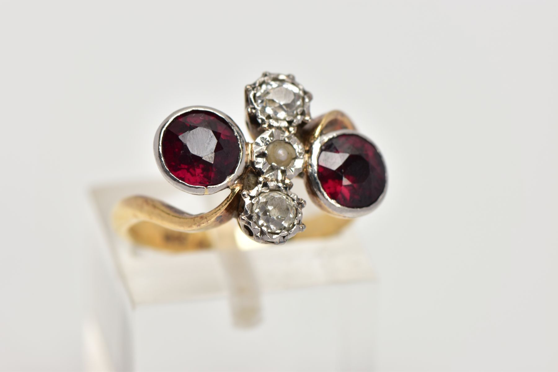 AN EARLY 20TH CENTURY 18CT GOLD GARNET AND DIAMOND DRESS RING, of a cross over design, the centre - Image 4 of 4