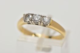 AN 18CT THREE STONE DIAMOND RING, designed as three brilliant cut diamonds within claw settings to