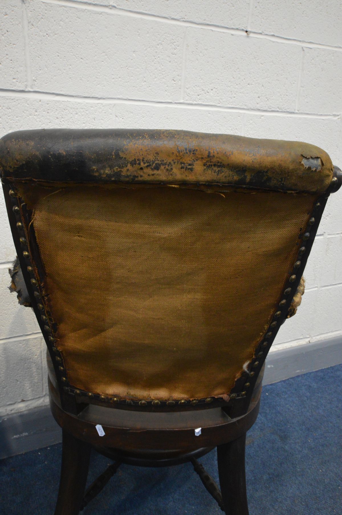 AN EARLY 20TH CENTURY MAHOGANY OFFICE ARMCHAIR, distressed leather, spindles armrests, dish seat, on - Image 6 of 7