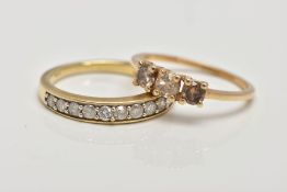 TWO 9CT GOLD DIAMOND SET RINGS, the first a three stone brilliant cut diamond ring with champagne