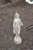 A MODERN COMPOSITE GARDEN FIGURE of a Grecian lady carrying two water ewers 80cm high