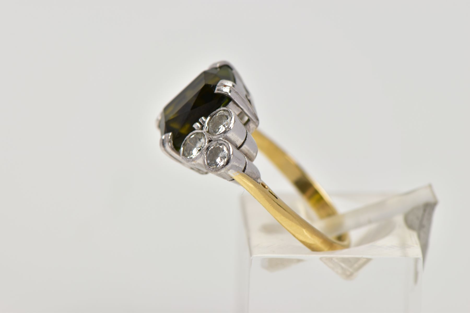 AN 18CT GOLD TOURMALINE AND DIAMOND DRESS RING, centring on an emerald cut green tourmaline, flanked - Image 2 of 4