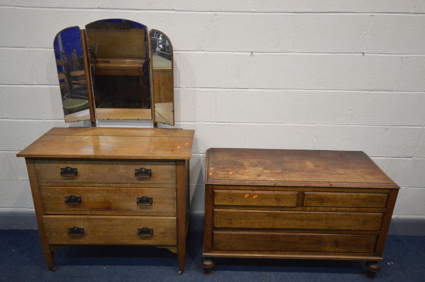 AN OAK DRESSING CHEST with a triple mirror and three long drawers, along with a low oak chest of