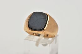 A GENTS 9CT GOLD SIGNET RING, set with a rounded rectangular cut onyx, plain polished band,