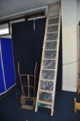 A MODERN DOLLE WOODEN TWELVE RUNG MEZZANINE LADDER construct in one length with no hinged joint