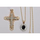 TWO 9CT GOLD GEM SET PENDANTS, the first designed as a diamond set cross with outer scalloped