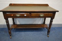 AN EDWARDIAN MAHOGANY DESK with a raised back, green leather inlay, on turned legs united by a under