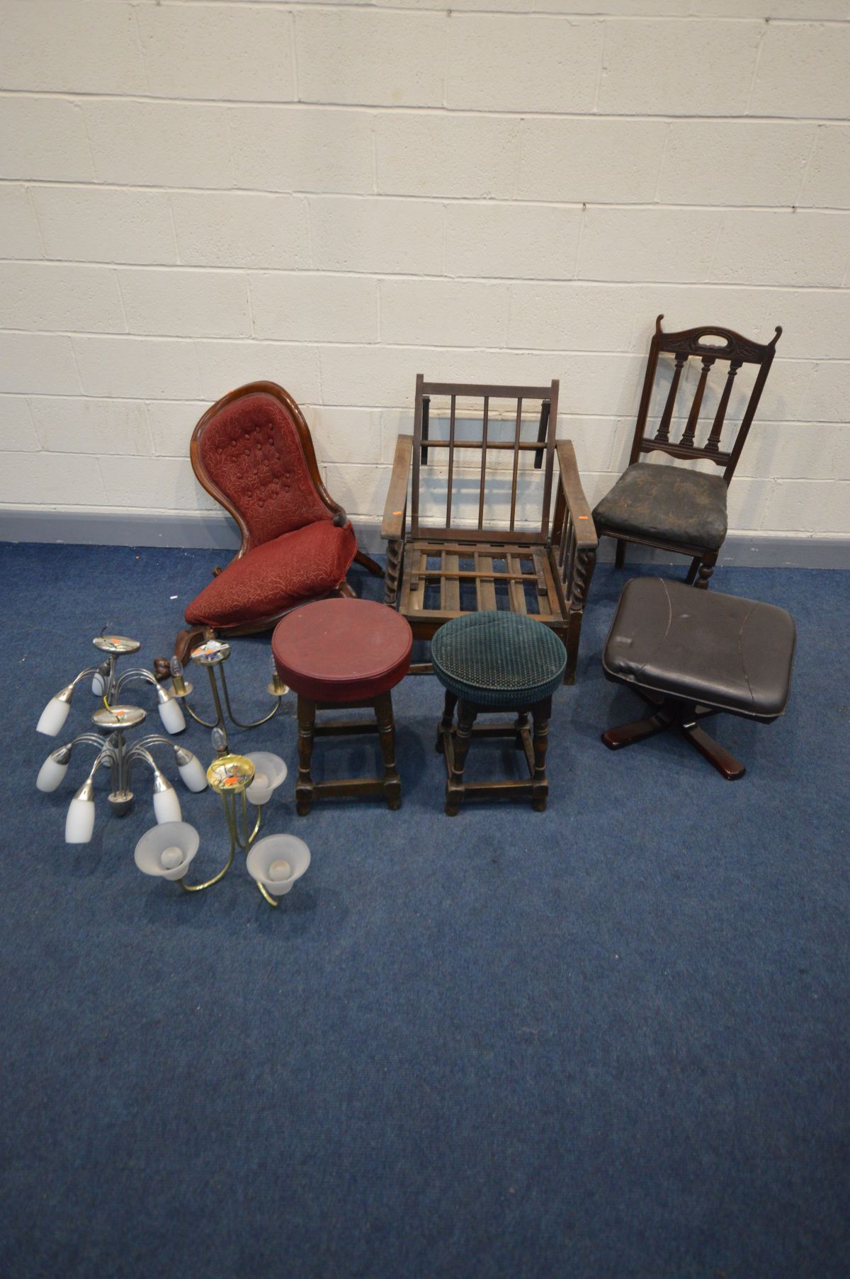 AN ARTS AND CRAFTS OAK RECLINING CHAIR (Sd and loose joints) along with a distressed Victorian spoon