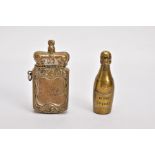 TWO BRASS VESTA CASES, the first in the form of a 'Veuve Cliquot' champagne bottle, hinged at the