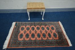 A PINK TEKKE RUG, 136cm x 79cm and a dressing stool (2)