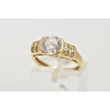 A 15CT GOLD CUBIC ZIRCONIA DRESS RING, designed with a central circular cut, colourless cubic