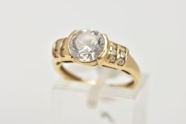 A 15CT GOLD CUBIC ZIRCONIA DRESS RING, designed with a central circular cut, colourless cubic