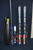 A PAIR OF SALOMON CROSSMAX08W SKIS with S8 10Ti clips and carrying bag, a pair of Salomon poles
