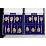 TWO CASED SETS OF SIX RUSSIAN SILVER GILT TEASPOONS, late 19th/early 20th Century in later cases,