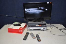 A TECHNIKA LCD24-620 24in TV with remote, an All in one aerial, a Hitachi video player with