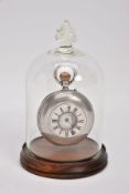 A MID VICTORIAN HALF HUNTER SILVER POCKET WATCH IN A BELL JAR GLASS DISPLAY CASE, the white face