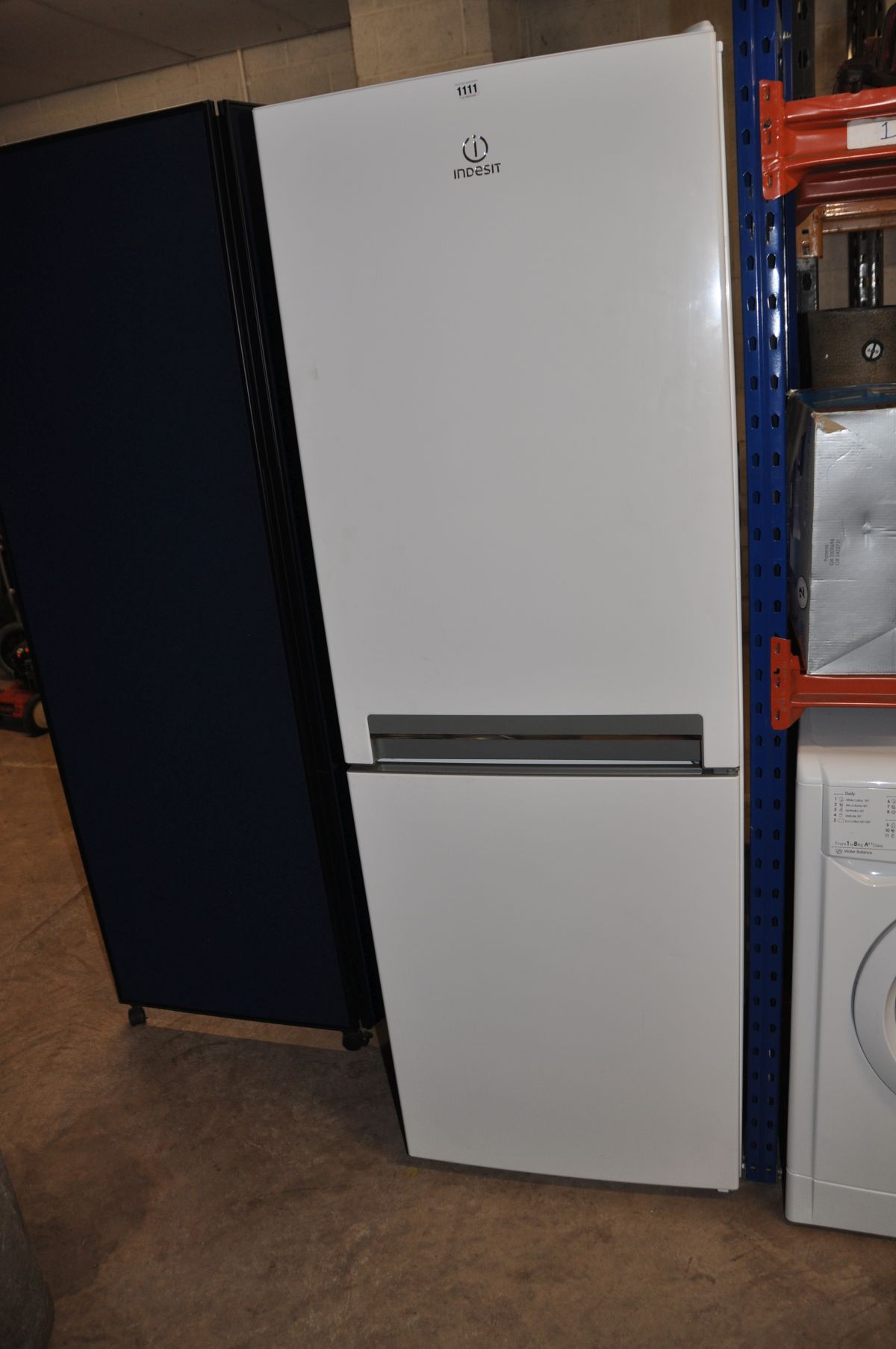 AN INDESIT TALL FRIDGE FREEZER 175cm high (PAT pass and working at 5 and -19 degrees)