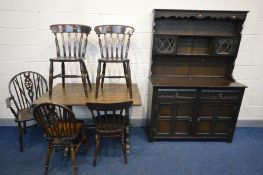 AN OAK DINING TABLE, length 122cm x depth 79cm x height 76cm, three stained beech kitchen chairs,