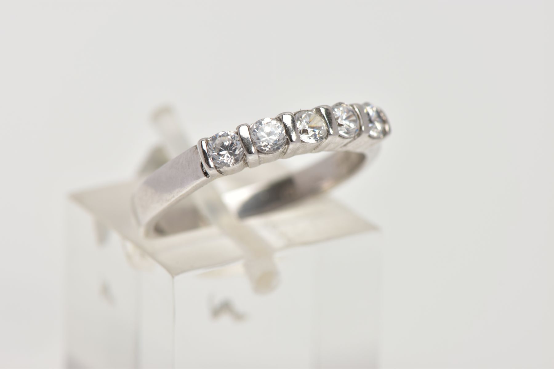 A 9CT WHITE GOLD HALF ETERNITY RING, designed with a row of five circular cut colourless cubic - Image 4 of 4