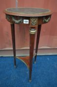 A LOUIS XVI STYLE CIRCULAR LAMP TABLE, with a brown leather inlay, on triple cylindrical fluted