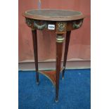 A LOUIS XVI STYLE CIRCULAR LAMP TABLE, with a brown leather inlay, on triple cylindrical fluted