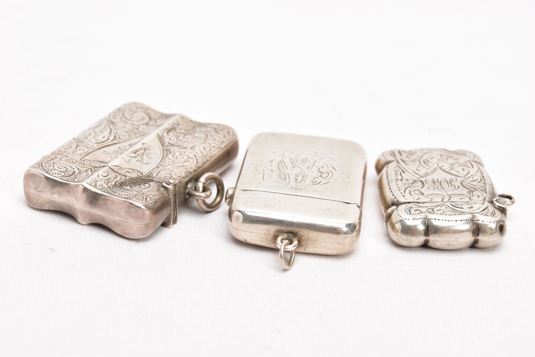 TWO LATE VICTORIAN SILVER VESTAS, AN EARLY 20TH CENTURY VESTA, AND A SMALL CERAMIC FIGURE, the first - Image 3 of 5