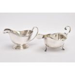 TWO SILVER SAUCE BOATS, the first with oval stepped base and gadroon pattern to the top edge,