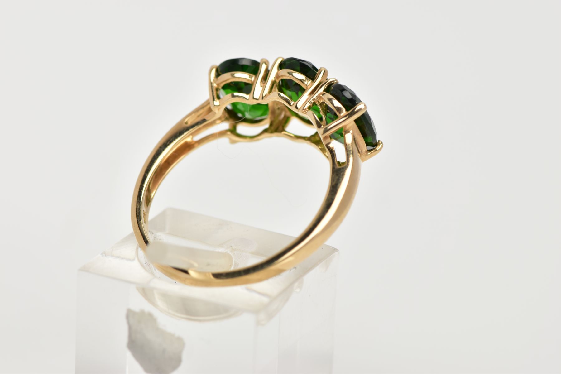 A 9CT GOLD THREE STONE TOURMALINE DRESS RING, designed with three oval cut, green stones assessed as - Image 3 of 4