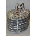 A SET OF THREE TOWNSHEND LTD ALUMINIUM STACKABLE COMMUNION WINE TRAYS, the top tier containing a