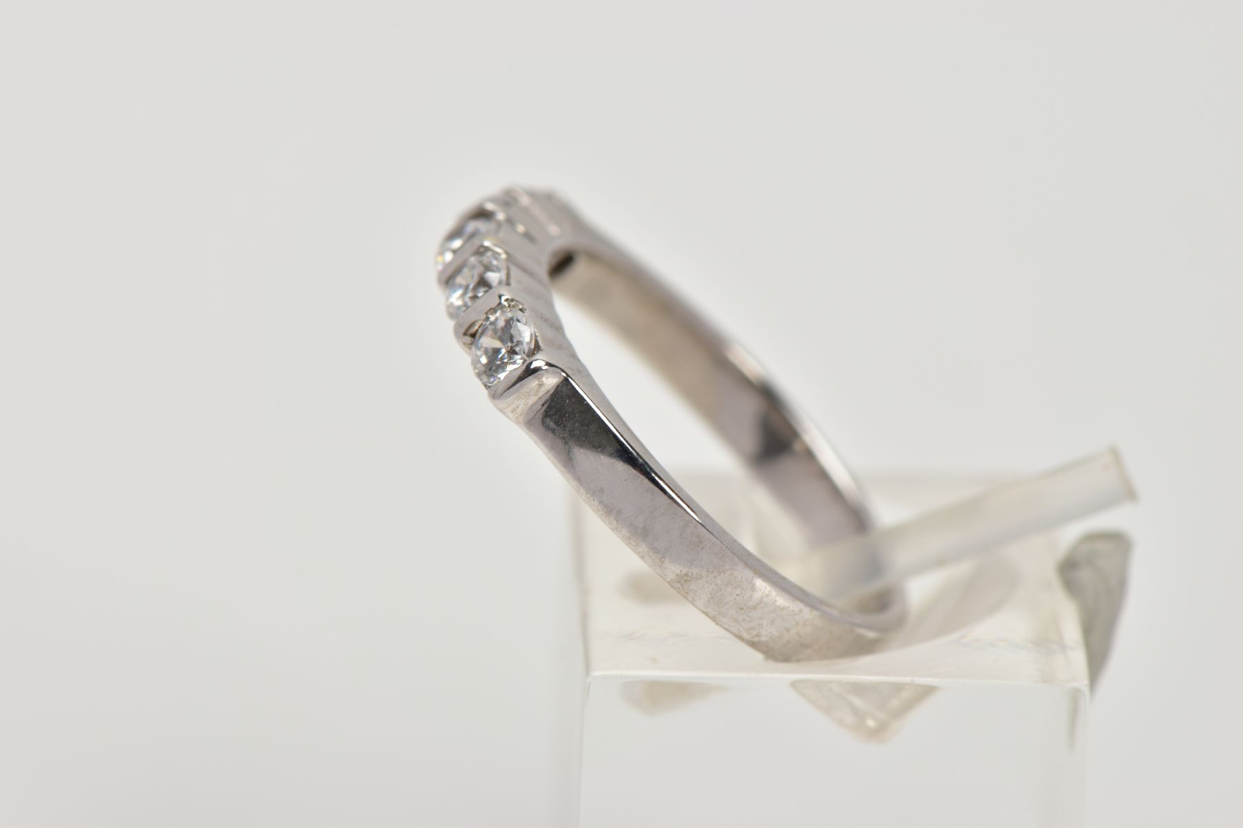 A 9CT WHITE GOLD HALF ETERNITY RING, designed with a row of five circular cut colourless cubic - Image 2 of 4