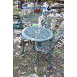 A MODERN CAST ALUMINIUM PAINTED GARDEN TABLE with pierced decoration and three matching chairs (