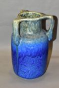 RUSKIN POTTERY, a three handled bottle shaped vase, mottled green fading to blue glaze, inscribed W.