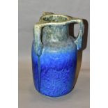 RUSKIN POTTERY, a three handled bottle shaped vase, mottled green fading to blue glaze, inscribed W.