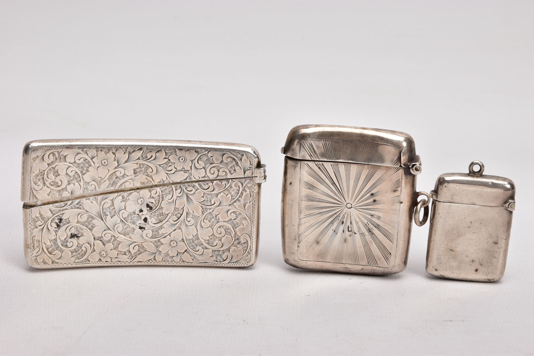 A SILVER CARD CASE AND TWO VESTAS, the card case decorated with an engraved foliate design and - Image 2 of 5