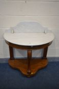 A VICTORIAN WALNUT DEMI LUNE WASHSTAND, with a marble top and raised back, width 96cm x depth 50cm x