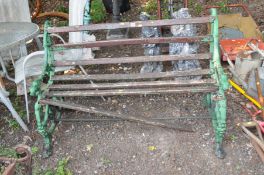 A VICTORIAN COALBROOKDALE STYLE CAST IRON GARDEN BENCH with foliate detail to arms terminating