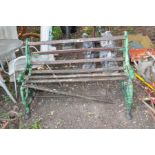 A VICTORIAN COALBROOKDALE STYLE CAST IRON GARDEN BENCH with foliate detail to arms terminating