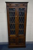 AN EARLY TO MID 20TH CENTURY LEAD GLAZED BOOKCASE, with four adjustable shelves, width 93cm x