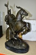 A BOXED REPRODUCTION BRONZE OF A JOUSTING KNIGHT ON HORSEBACK on a marble style plinth,