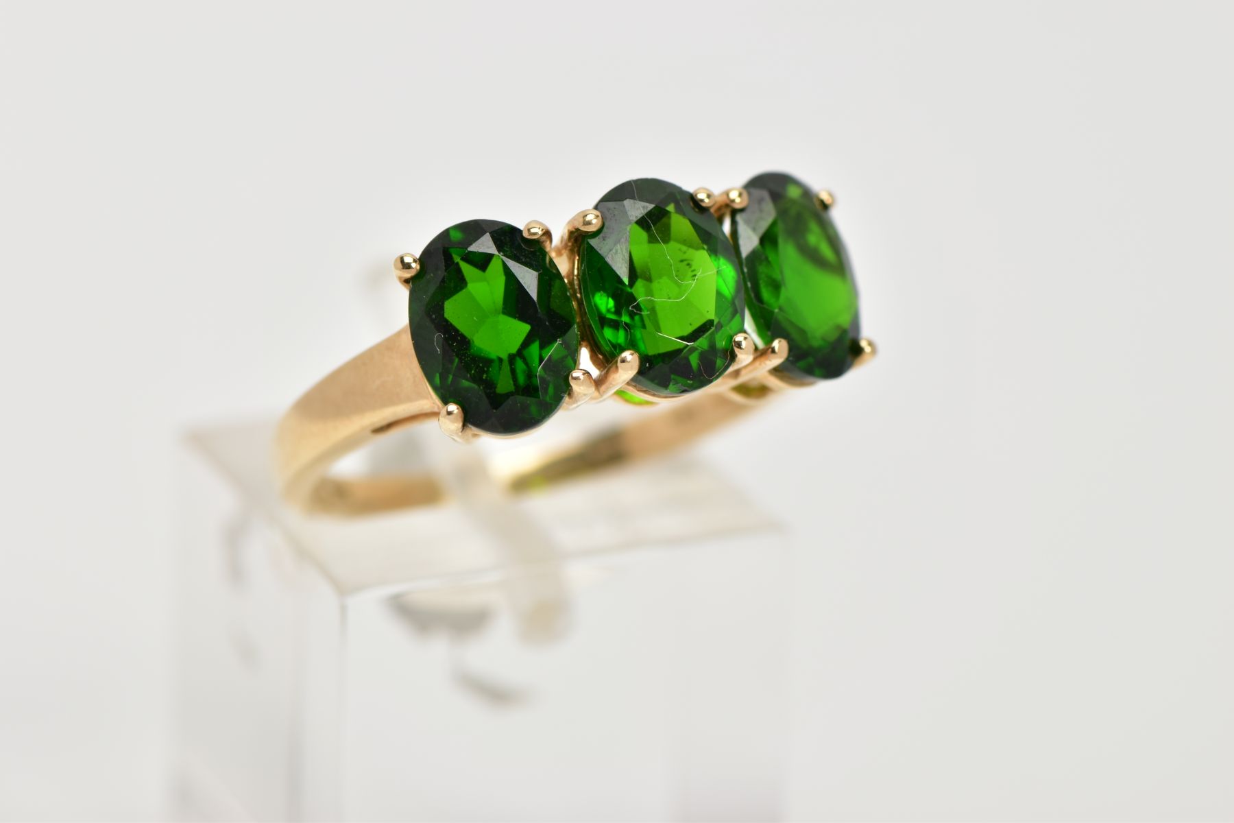 A 9CT GOLD THREE STONE TOURMALINE DRESS RING, designed with three oval cut, green stones assessed as - Image 4 of 4