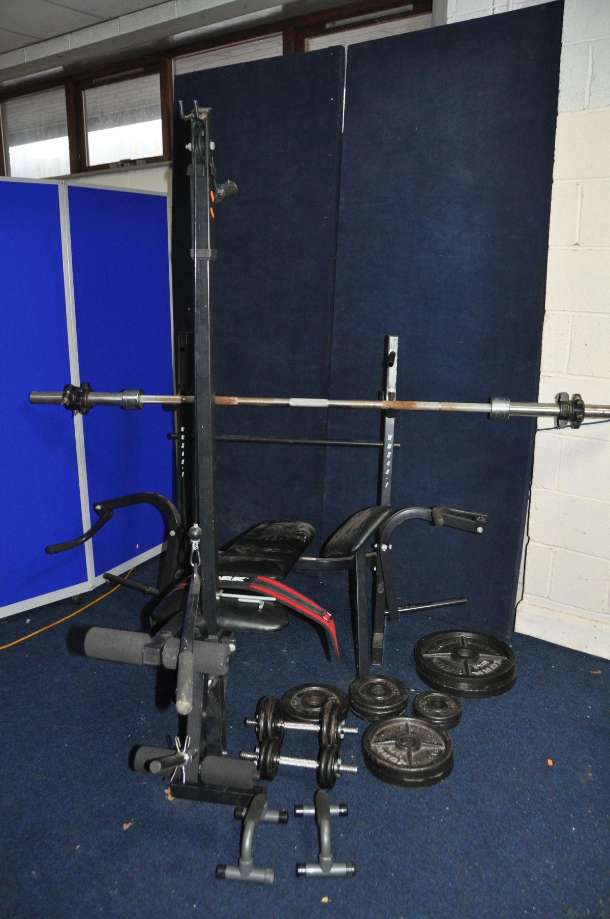 A MARCY WM348-1 WEIGHT BENCH with an Olympic bar, sixteen York Olympic Standard Barbells (2 at