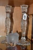 A PAIR OF WATERFORD CRYSTAL CANDLESTICKS AND A SILVESTRIA FROSTED AND CLEAR GLASS APPLE, the