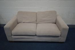 A BEIGE UPHOLSTERED SOFA, length 172cm