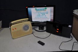 A TECHNIKA 19in LCD TV DVD combi (no remote), a Panasonic SC-HC200 music player and a Bush Retro