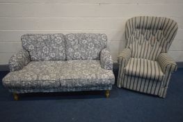 A FLORAL UPHOLSTERED SOFA, length 155cm, and a stripped upholstered rocking armchair (2)